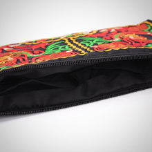 The image is of a close-up of the interior of the Double Dragon Embroidered Clutch.